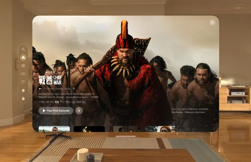 The Apple TV+ experience of Apple Vision Pro is displayed in a living room, with a still image from the Apple TV+ series Chief of War