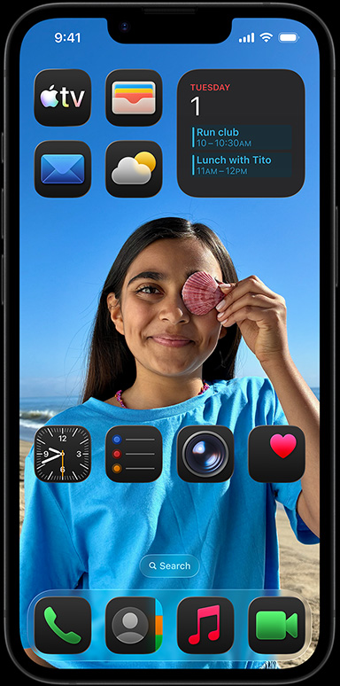 iPhone 16e surrounded by apps like Apple Mail, WhatsApp, Safari, Apple Maps, Apple Music, Photos, Notes and Home