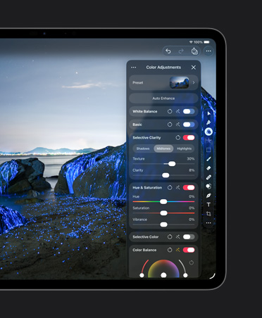 iPad Pro 13 screen, photo of boulders on a beach with blue glows, colour adjustments tools