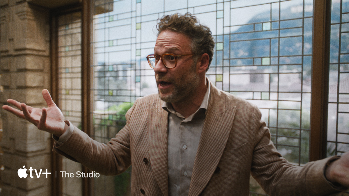 A flatscreen television showing a static image of "The Studio" available on Apple TV+