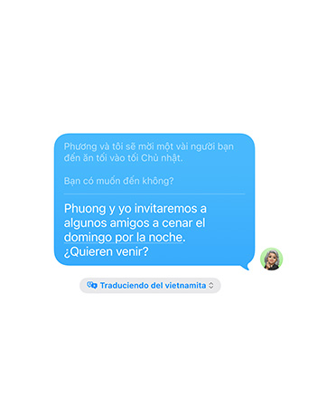 Live Translation in Messages with the user’s text message “Adriana and I will invite some friends to dinner on Sunday night. Do you want to come?” automatically translated into Spanish